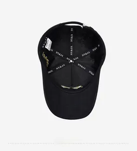Detail shot of the interior of a black baseball cap with logo-printed inner tape and tags