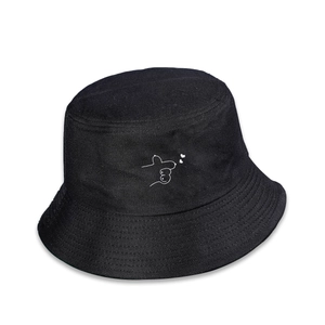 Detailed embroidery of white abstract lines and hearts on a black cotton bucket hat