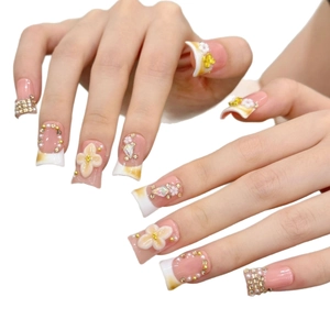 French tip press-on nails with 3D floral accents, pearls and crystal embellishments