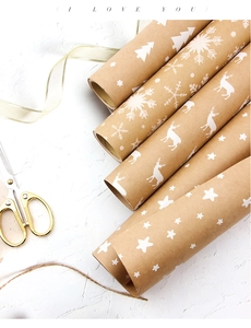 Brown kraft wrapping paper featuring white Christmas elk and snowflake patterns with jute rope