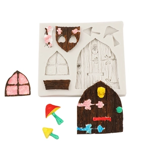Detail of fairy house silicone mold showing wooden door, window and mushroom clay crafts