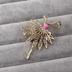 Golden ballet dancer brooch with pink enamel and sparkling crystals on velvet display box