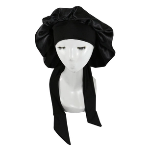 Close-up of black satin sleep bonnet with wide elastic headband and long adjustable straps
