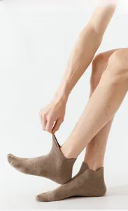 Detail view of tan low cut cotton ankle socks for men featuring breathable elastic cuffs