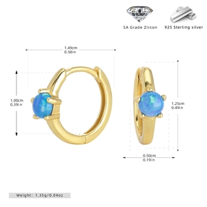 Detail view of gold S925 sterling silver hoop earrings with blue opal stones and 5A zircon