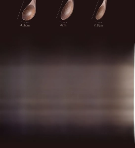 Detailed comparison of three walnut wood spoons showing grain and size measurements