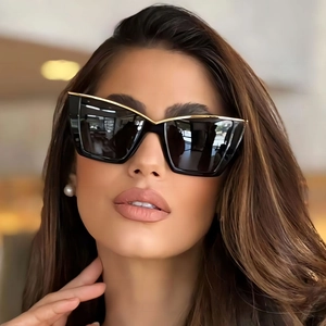 Chic black cat eye oversized sunglasses with gold metal top bar for stylish women