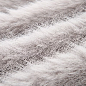 Detailed macro shot of premium grey and white faux fur texture showing soft plush fibers