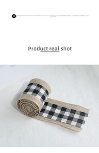 Macro shot of rustic black and white buffalo plaid burlap ribbon for DIY gift wrapping