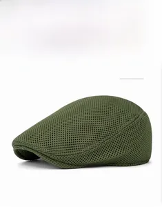 Detail of dark green mesh fabric on breathable summer flat cap for ventilation