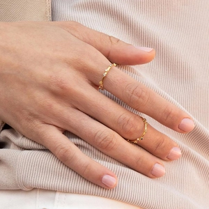 Minimalist 18k gold plated ring set with colorful zircon and beaded band on model hand