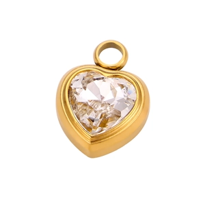 Elegant gold heart pendant with a large clear crystal stone and polished metal frame