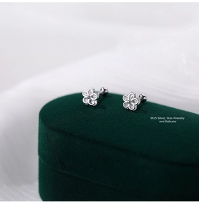 Macro shot of S925 sterling silver floral stud earrings with cubic zirconia stones
