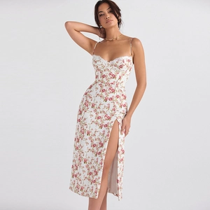 Detail of floral print dress with elegant lace trim and stylish side slit feature