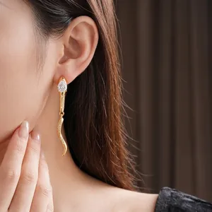 Elegant gold snake drop earrings with teardrop zircon and pavé setting for women