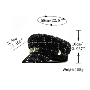Detail of tweed newsboy cap showing dimensions and black leather strap with gold buckle