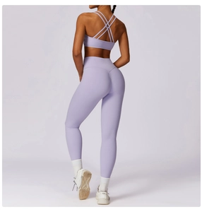 Detail of lavender yoga set showing cross-back sports bra and high-waist seamless leggings