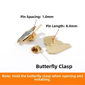 Detailed view of black crow bird pin back with 8mm needle length and butterfly clasp