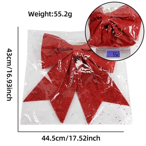Detail view of a large red glitter Christmas bow with 43cm x 44.5cm size and weight specs