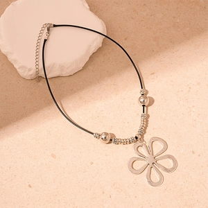 Vintage hollow flower pendant necklace with silver hammered texture on black cord