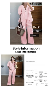 Detail view of pink polyester two-piece set with V-neck puff sleeve top and wide leg pants