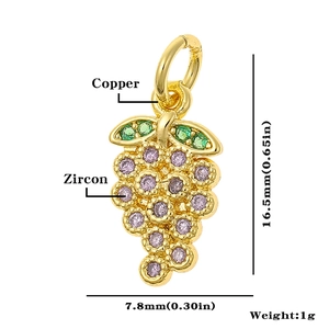 Detail view of golden grape pendant with zircon and copper including product dimensions
