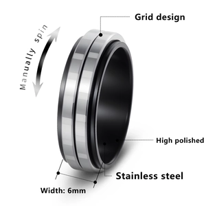 6mm black and silver spinner ring in stainless steel with a high-polished grid design