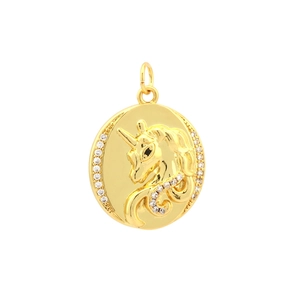 Close-up of gold-plated unicorn sun pendant with cubic zirconia inlay detail