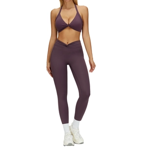 Women's deep purple yoga set with halter sports bra and high-waisted leggings