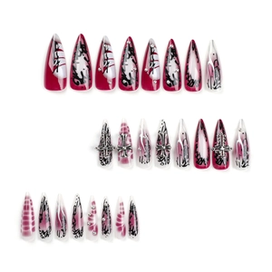 Gothic stiletto press-on nails with red and black ink marble design and silver crosses