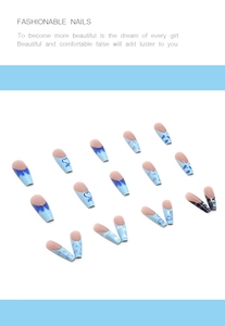 Blue long stiletto press-on nails with heart, eye, and geometric checkerboard patterns