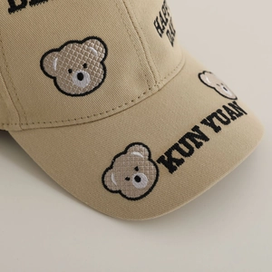 Kids khaki cotton baseball cap featuring detailed bear embroidery and black lettering