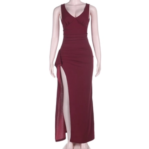 Detailed view of burgundy sleeveless maxi dress featuring a high side slit and V-neckline