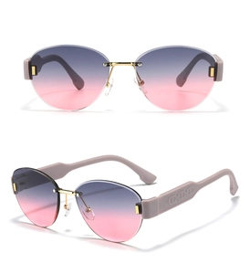 Detail of rimless gradient sunglasses featuring gold hinges and CD logo on temples