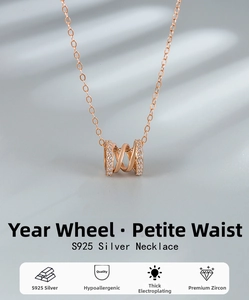 Detail of rose gold S925 silver cylinder pendant with white zircon inlays and cross chain