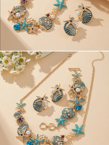 Détail de parure collier et bracelet étoile de mer et coquillage avec émail turquoise