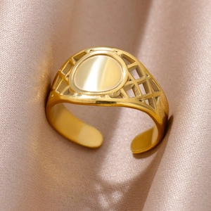 Detail of 18k gold-plated snake ring with hollow mesh sides on champagne silk fabric