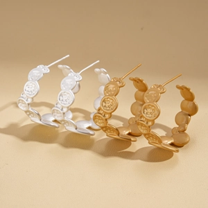 Textured irregular C-shaped hoop earrings in gold and silver finish for women