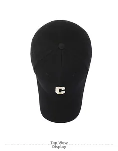 Top view of a black baseball cap featuring a white embroidered letter C on cotton twill