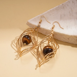 Golden hollow leaf earrings with tiger eye beads in a vintage geometric twisted design