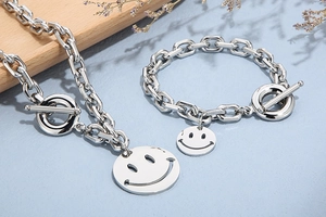 Polished silver stainless steel chain jewelry set with smile pendants and T-bar clasps