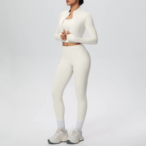 Detail of high-waisted yoga pants and zip jacket fabric texture in white