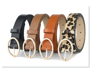 Set of four women's PU belts in black, brown, khaki, and leopard print with gold buckles