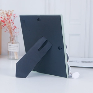 Creative 7-inch cartoon photo frame with light green border and dual-use back stand