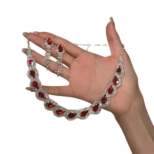 Silver jewelry set with red teardrop gems and rhinestones necklace and earrings