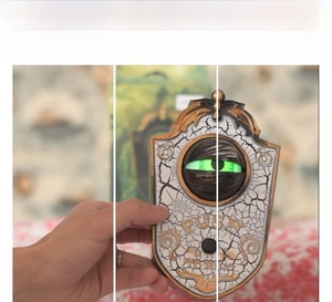 Halloween eyeball doorbell showing back switch and sound output area for spooky props