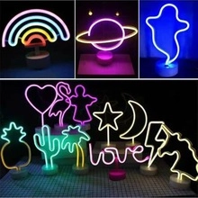 Multiple LED neon sign light shapes with round bases for bedroom decor and festive atmosphere