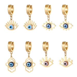 Set of four gold stainless steel huggie earrings featuring evil eye and hamsa hand charms