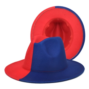 Detail view of red and blue two-tone wool fedora hat with wide brim and jazz style crown