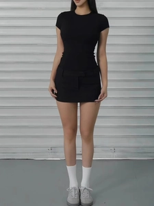 Slim fit black short sleeve T-shirt and mini skirt set shown on model against backdrop
